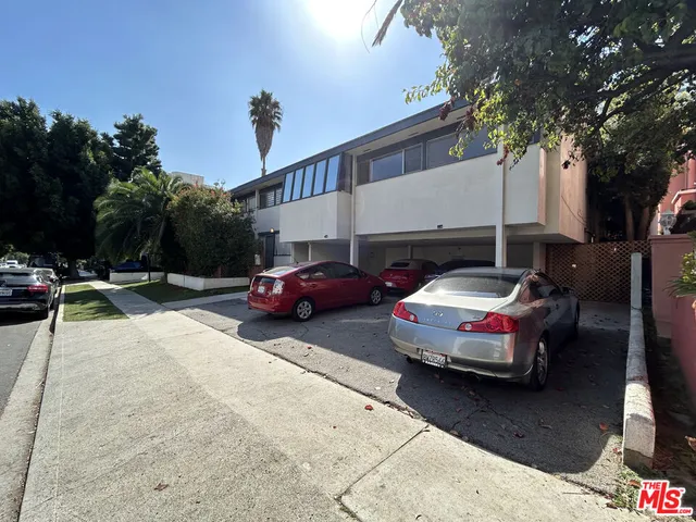 a view of a cars park in front of house