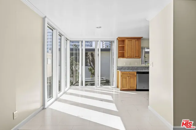 a view of a bedroom with balcony and door