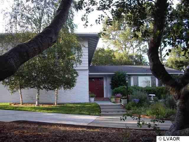 1359 Onstott Road Lompoc, CA 93436 - Photo 1 of 15 a front view of a house with garden