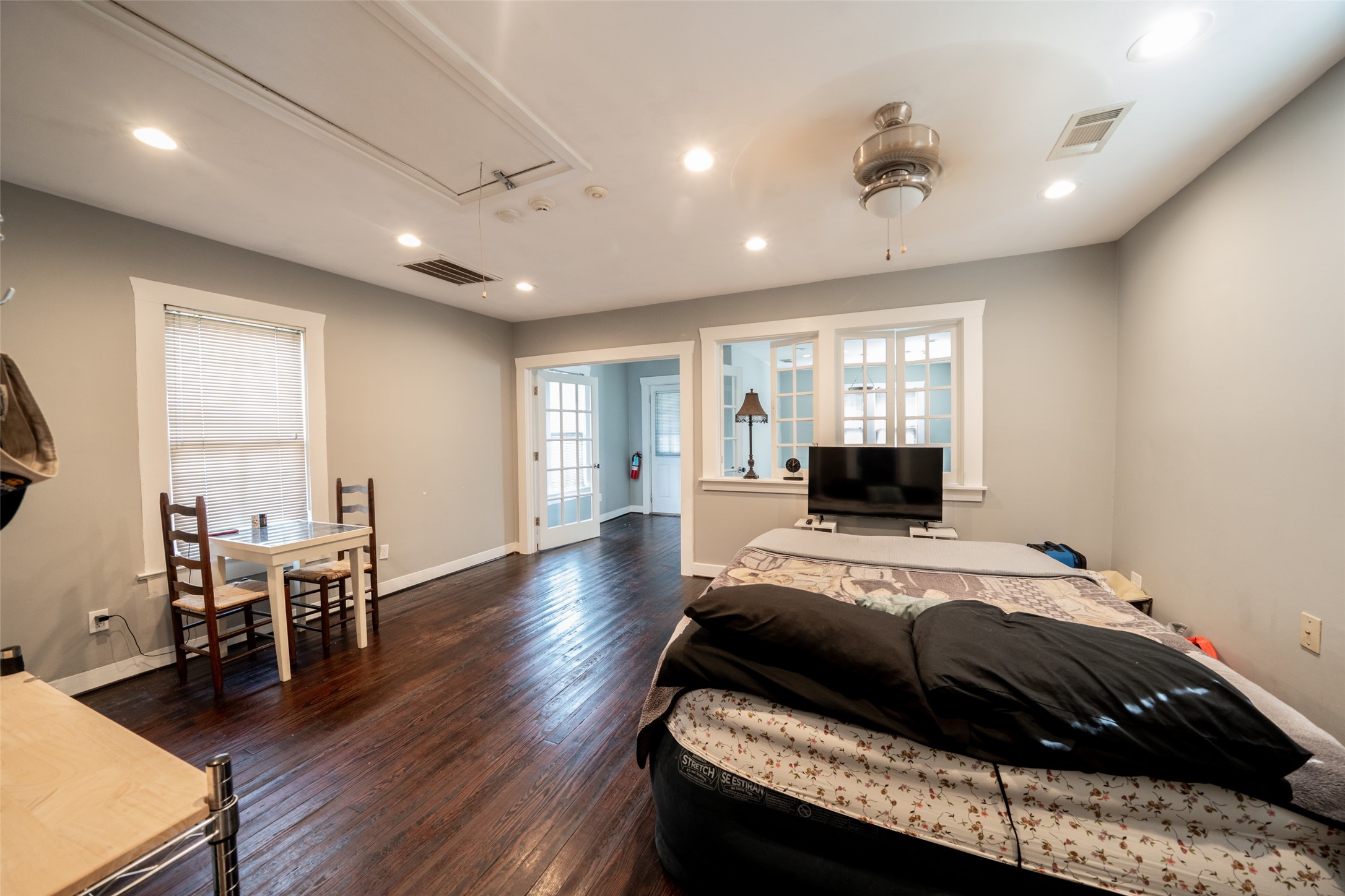 811 Yale Street Houston, TX 77007 - Photo 14 of 38 a bedroom with a bed and a view of living room