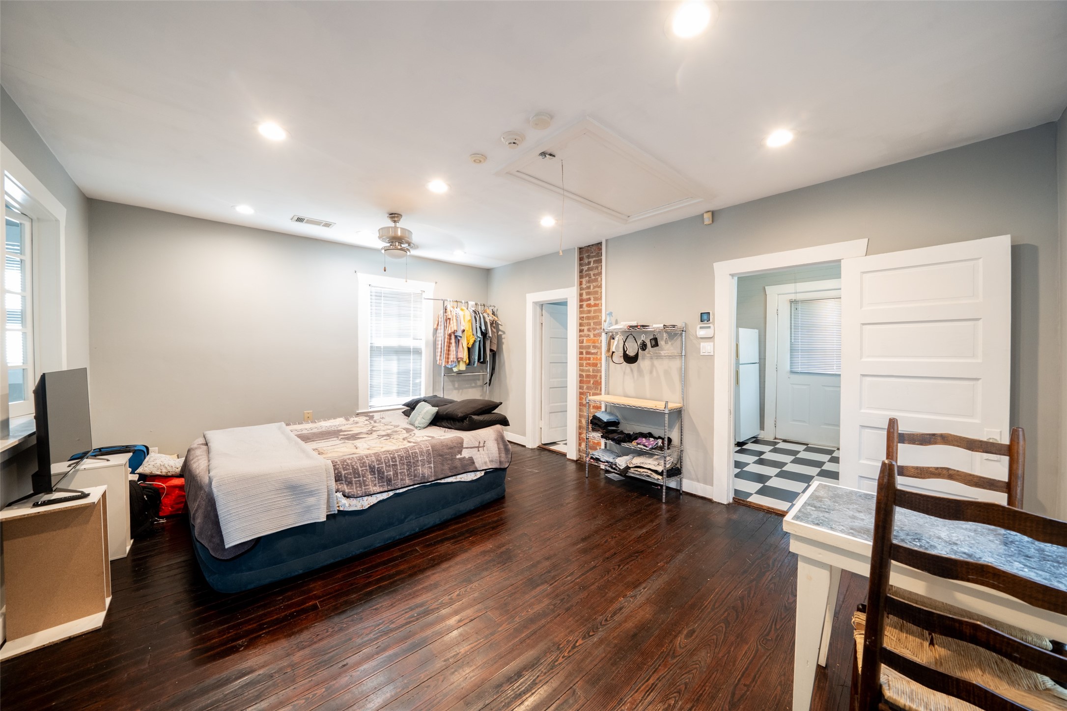 811 Yale Street Houston, TX 77007 - Photo 15 of 38 a bedroom with a bed and wooden floor