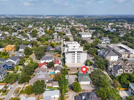 an aerial view of residential houses with city view