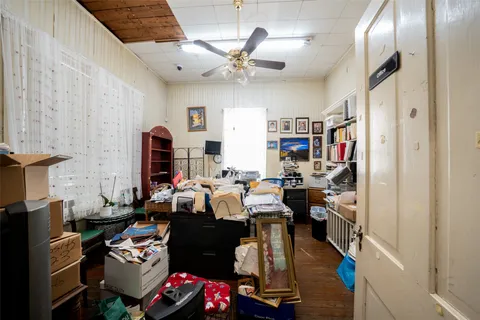 a living room with lots of furniture and a chandelier