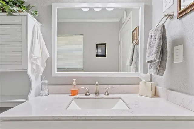 a bathroom with a bathtub and sink