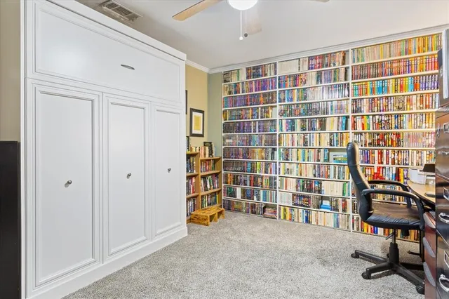 a view of an empty room with a bookshelf