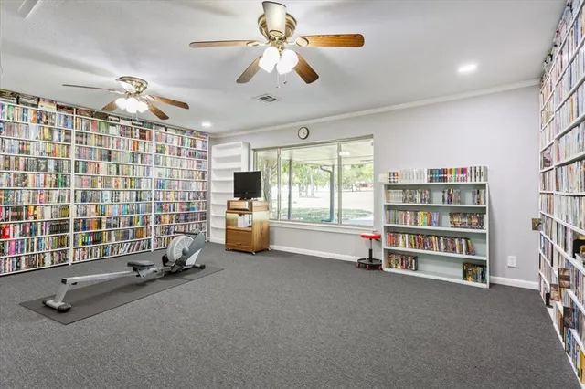 a view of a livingroom with furniture and a large window