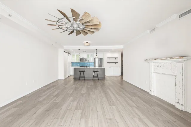 a view of a hallway with a wooden floor