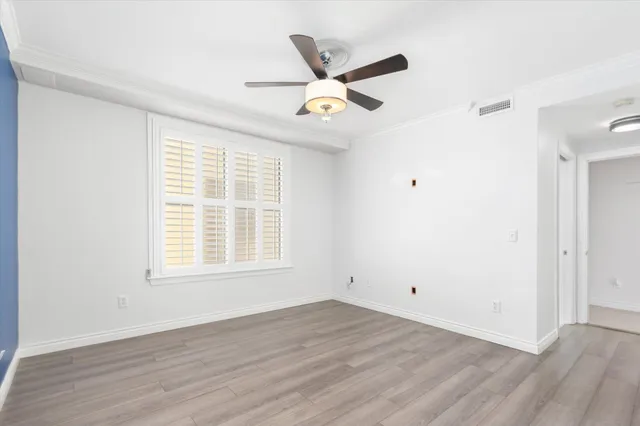 wooden floor in a room with a window