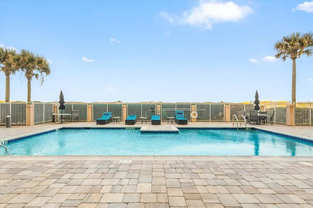 a view of a swimming pool with a terrace
