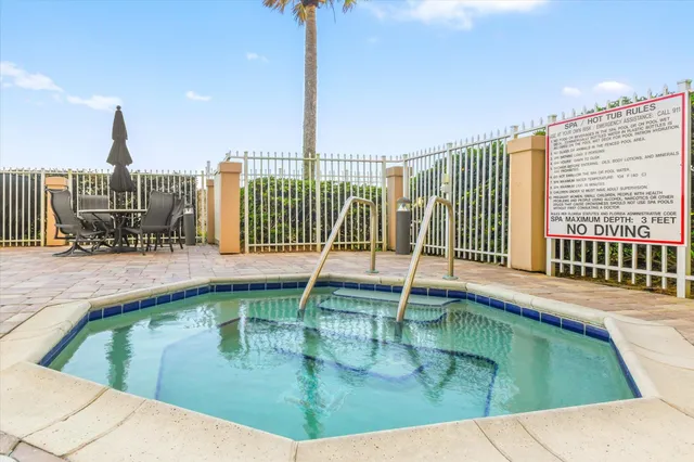 a swimming pool with outdoor seating and yard