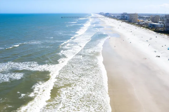 a view of swimming pool with outdoor seating