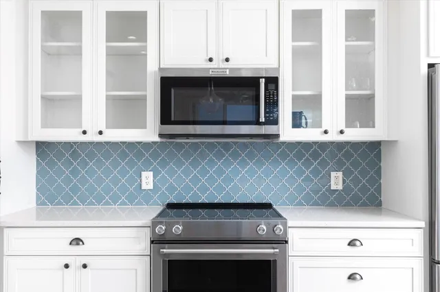 a kitchen with a stove and a microwave