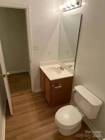 a bathroom with a toilet and a bath tub