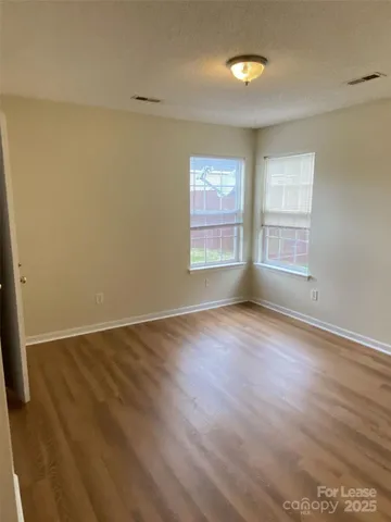 a view of hallway with wooden floor
