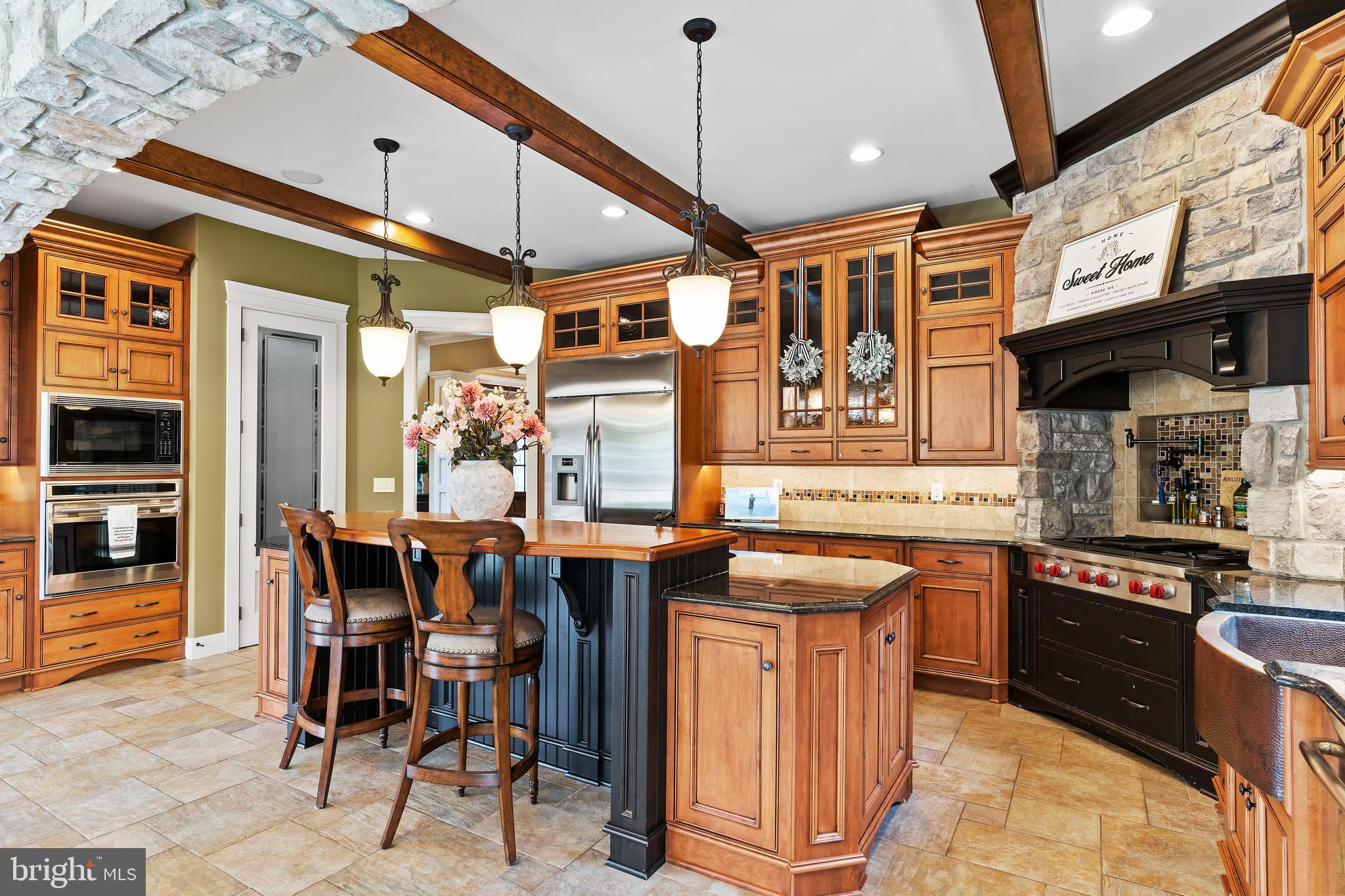 506 Jonagold Circle Mechanicsburg, PA 17055 - Photo 21 of 87 a kitchen with stainless steel appliances granite countertop a sink and cabinets