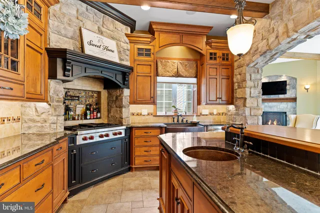 a bathroom with a granite countertop double vanity sink and a mirror