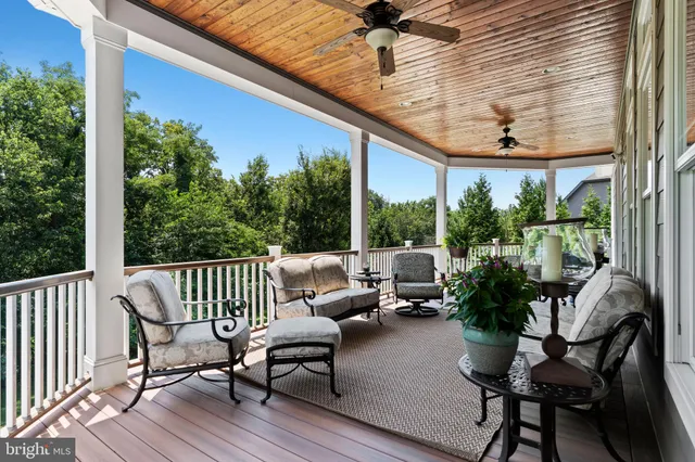 a view of a livingroom with furniture and a floor to ceiling window