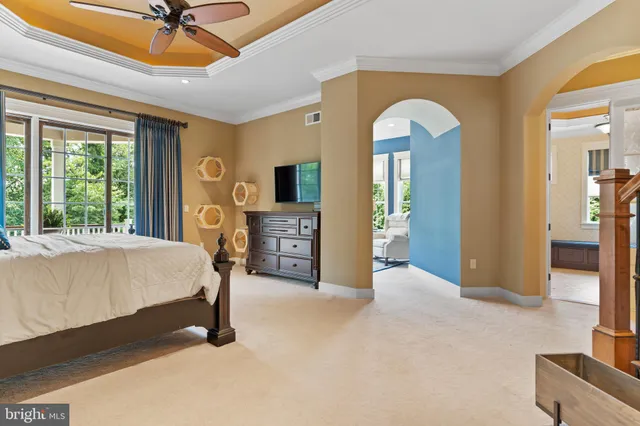 a bedroom with a bed and a couch