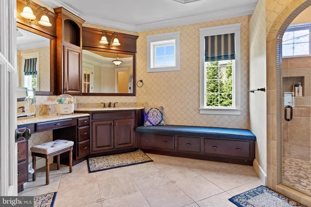 a bedroom with a bed and a flat tv screen on the dresser