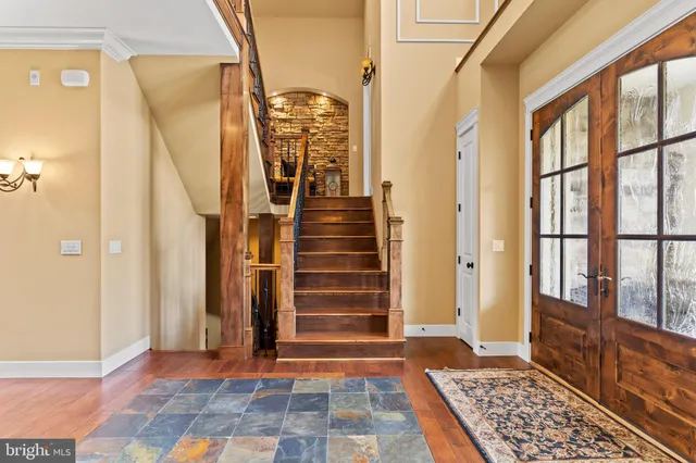 a outdoor space with patio the couches and a fireplace