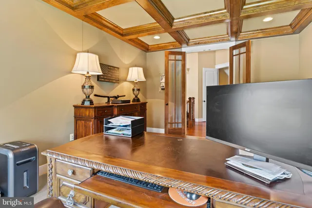 a front view of a house with yard and green space