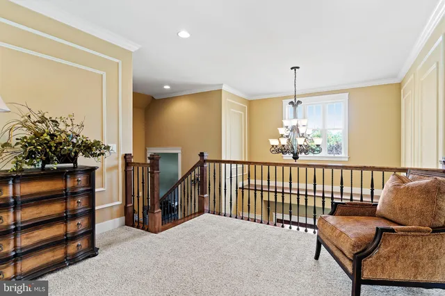 an aerial view of a house with garden space and car parked