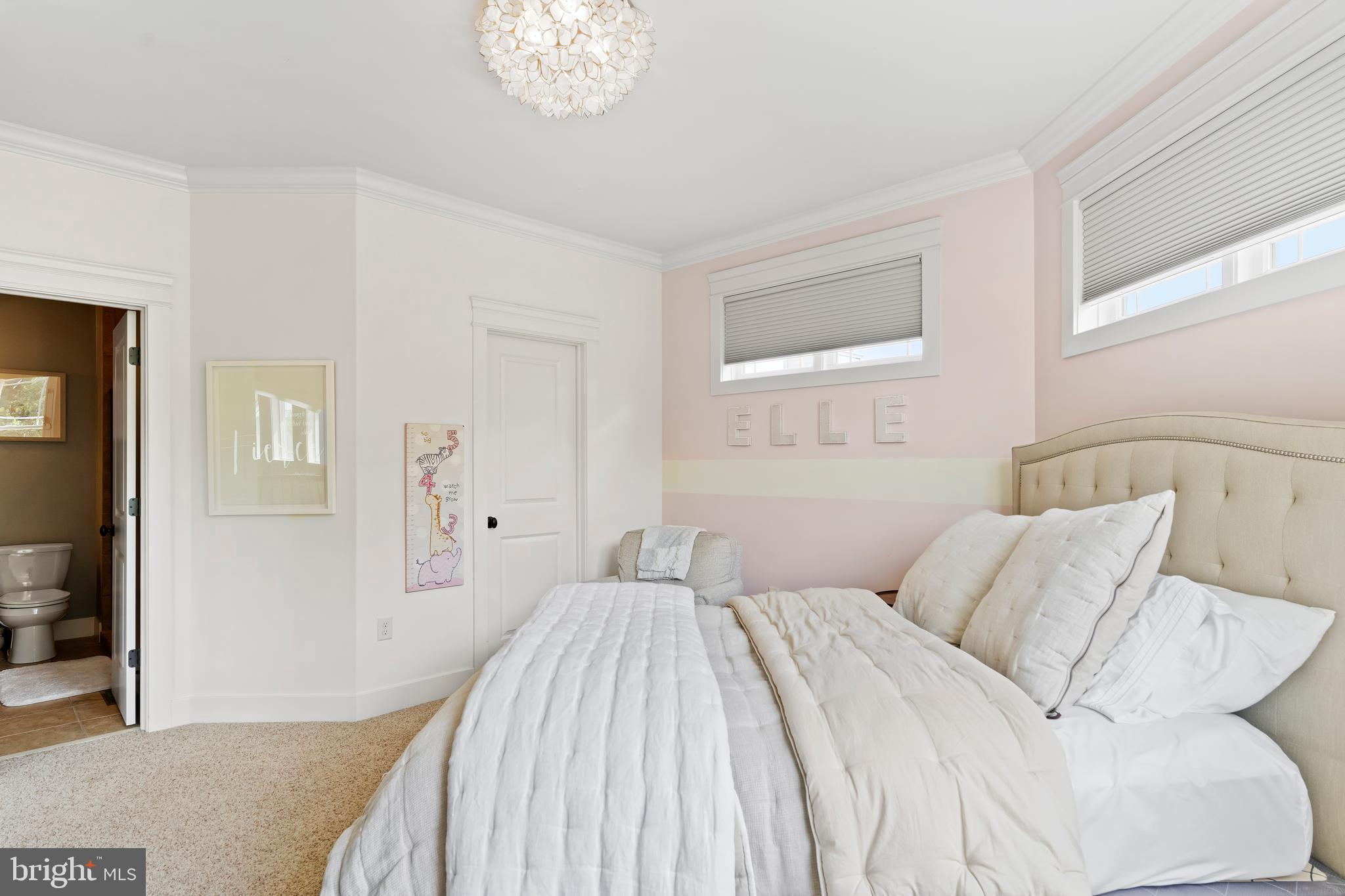 506 Jonagold Circle Mechanicsburg, PA 17055 - Photo 52 of 87 a bedroom with a bed and a chandelier