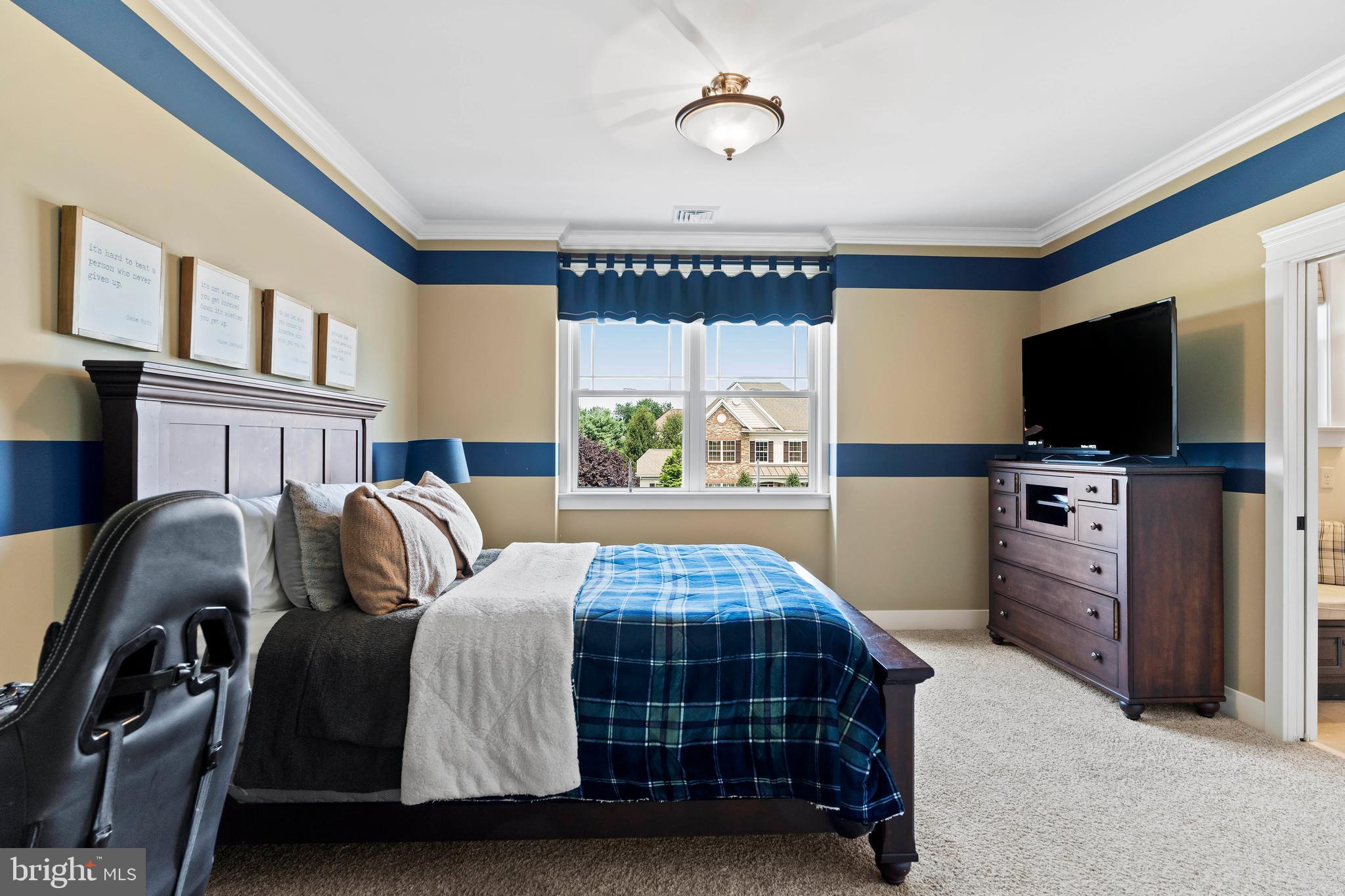 506 Jonagold Circle Mechanicsburg, PA 17055 - Photo 55 of 87 a bedroom with a bed and a flat tv screen on the dresser