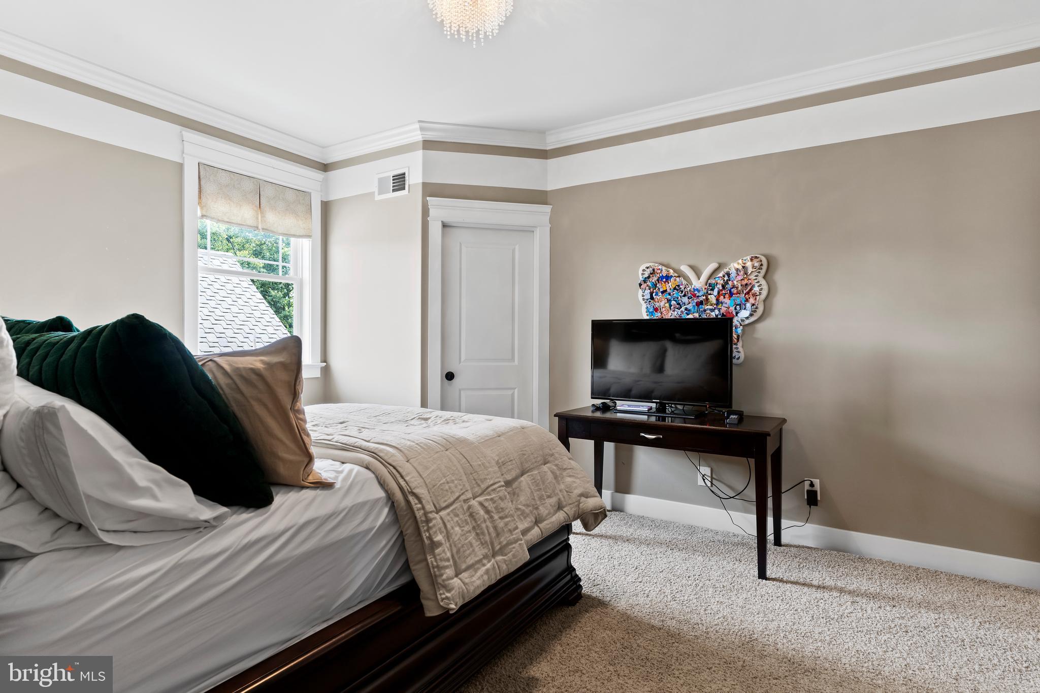 506 Jonagold Circle Mechanicsburg, PA 17055 - Photo 59 of 87 a bedroom with a bed window and a chair