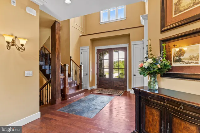 a view of bathroom with a sink and mirror