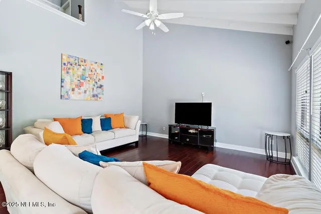 a bedroom with a bed and with wooden floor