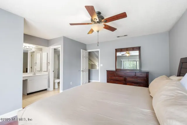 a view of a lake with houses in back