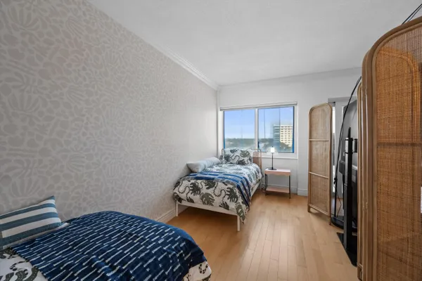a bedroom with a bed and a dresser