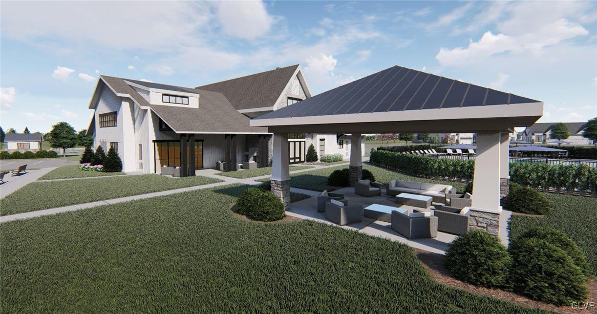 6916 Cedar Drive Bath, PA 18014 - Photo 18 of 19 a view of a house with backyard sitting area and garden