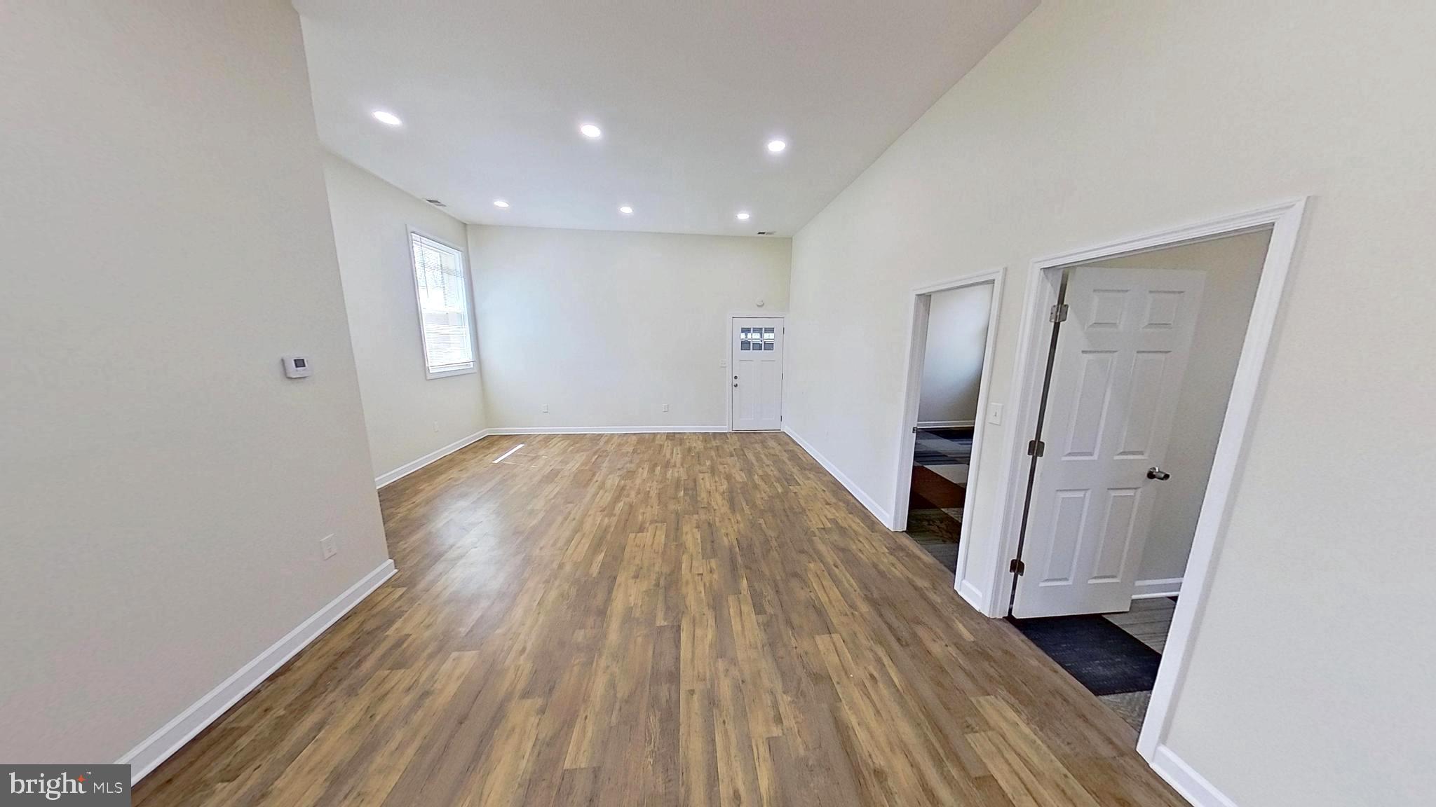 3842 Stoneybrook Road, Unit B White Plains, MD 20695 - Photo 11 of 23 a view of a room with wooden floor and staircase