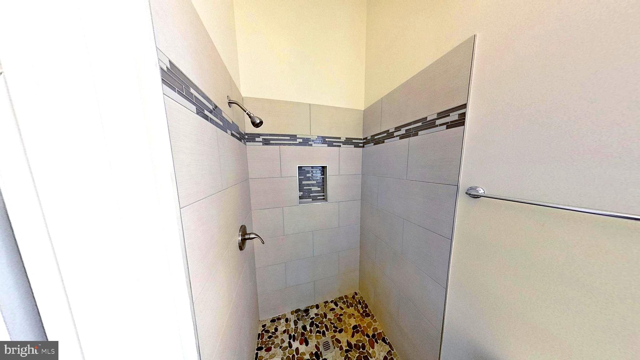 3842 Stoneybrook Road, Unit B White Plains, MD 20695 - Photo 14 of 23 a bathroom with a shower