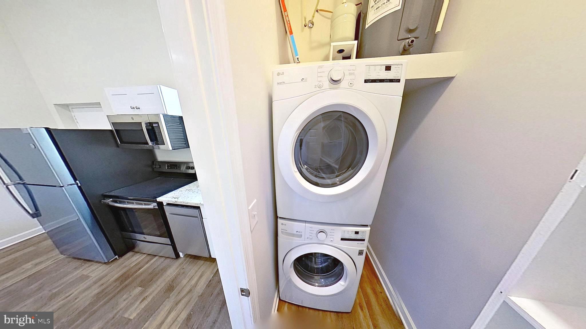3842 Stoneybrook Road, Unit B White Plains, MD 20695 - Photo 15 of 23 a view of a storage and utility room with washer and dryer