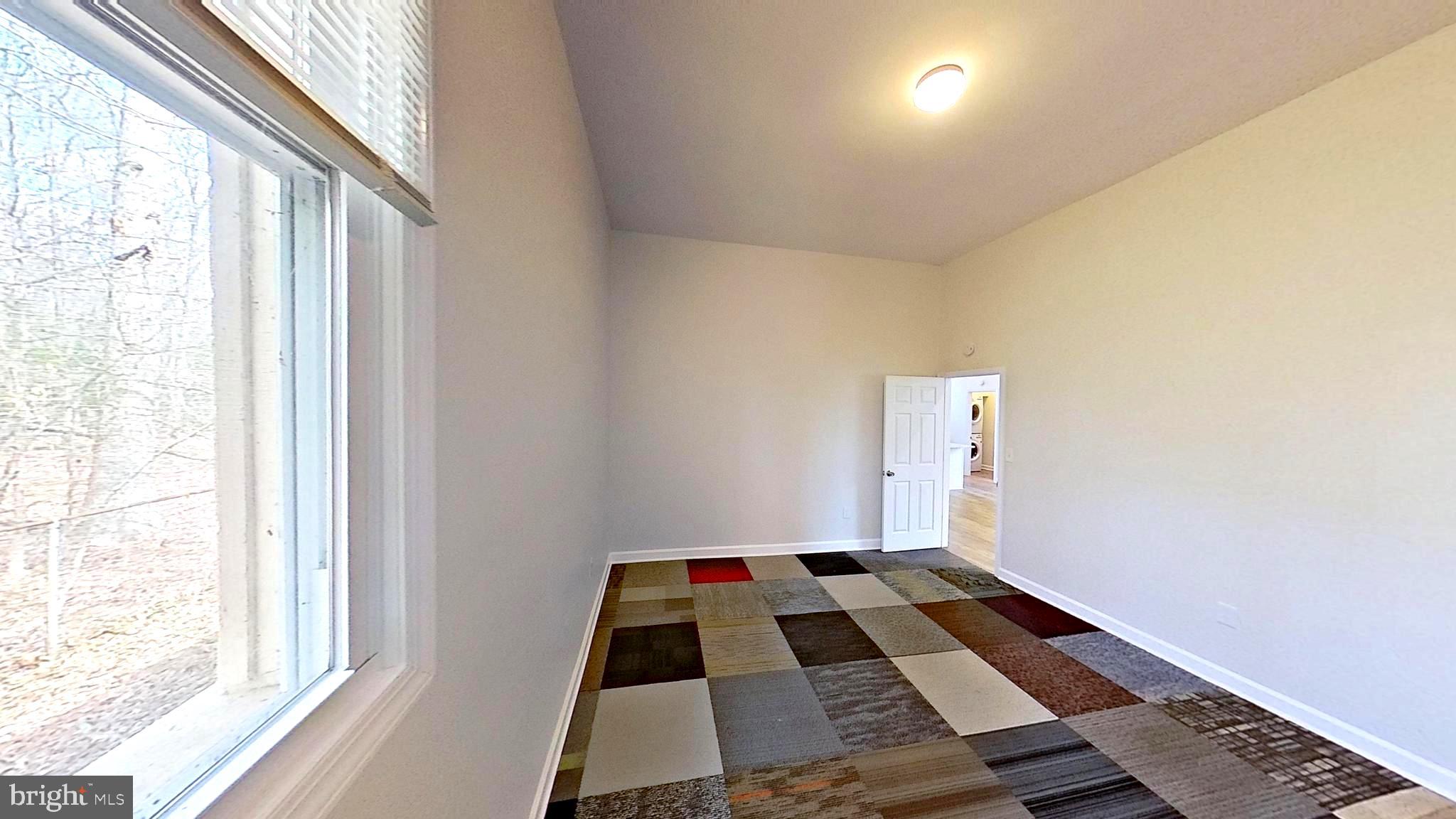 3842 Stoneybrook Road, Unit B White Plains, MD 20695 - Photo 6 of 23 a room with window and a rug