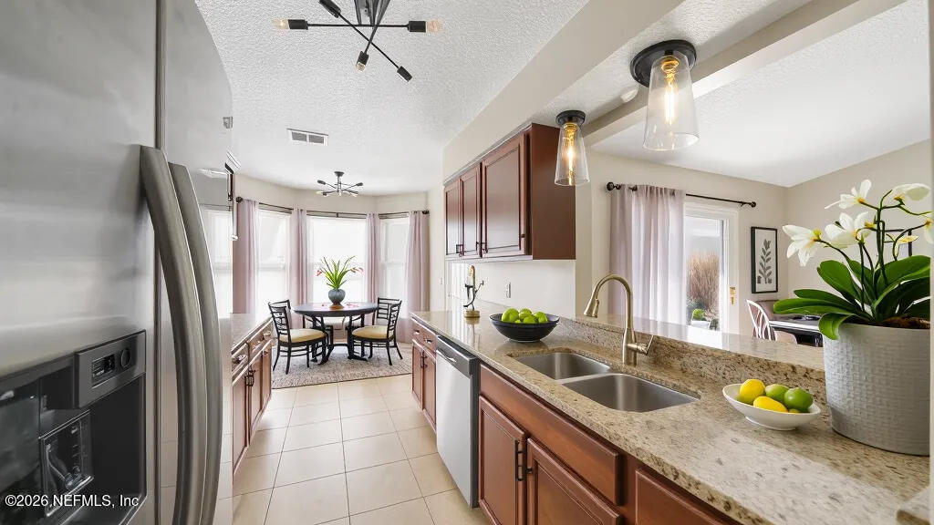3255 Dowitcher Lane Orange Park, FL 32065 - Photo 11 of 39 a kitchen with sink a counter and cabinets