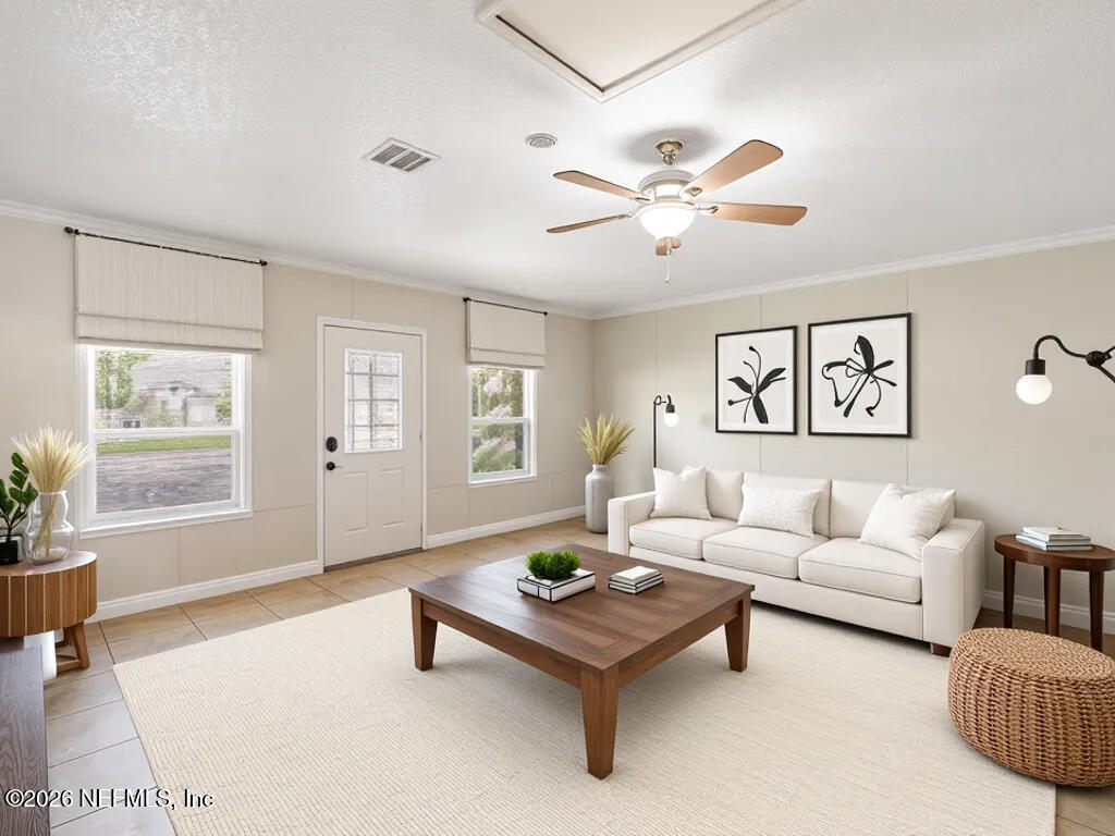 3255 Dowitcher Lane Orange Park, FL 32065 - Photo 13 of 39 a living room with furniture a table and a large window