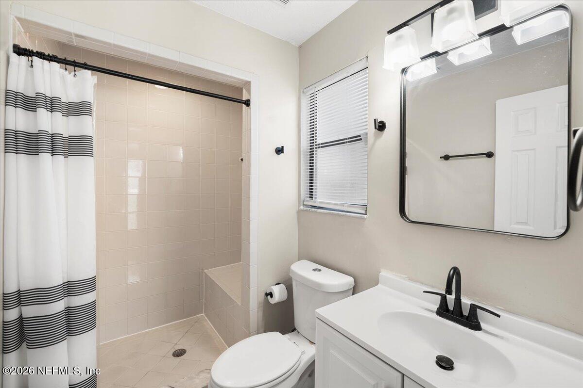 3255 Dowitcher Lane Orange Park, FL 32065 - Photo 20 of 39 a bathroom with a sink a toilet and shower
