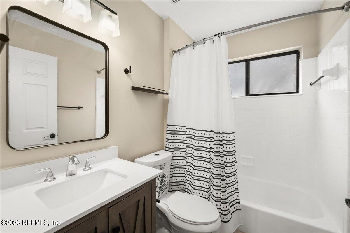 3255 Dowitcher Lane Orange Park, FL 32065 - Photo 25 of 39 a bathroom with a sink a toilet and shower