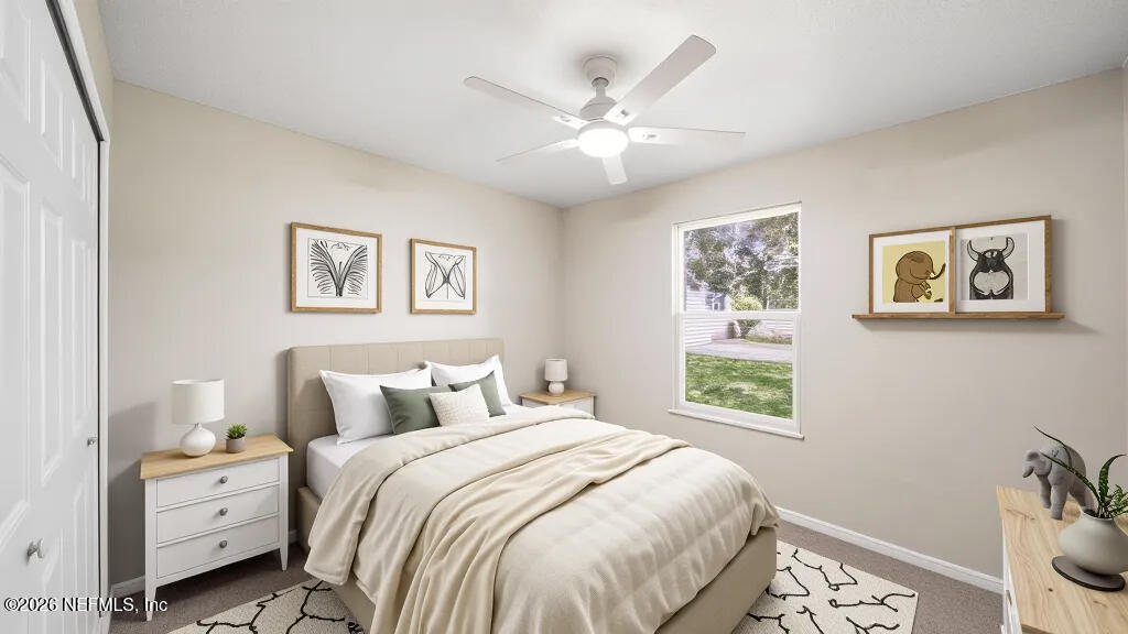 3255 Dowitcher Lane Orange Park, FL 32065 - Photo 27 of 39 a bedroom with a bed and a window