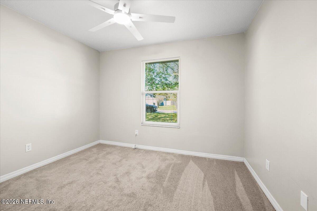 3255 Dowitcher Lane Orange Park, FL 32065 - Photo 28 of 39 an empty room with a window and a fan
