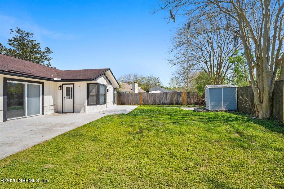 3255 Dowitcher Lane Orange Park, FL 32065 - Photo 33 of 39 a front view of house with yard and green space