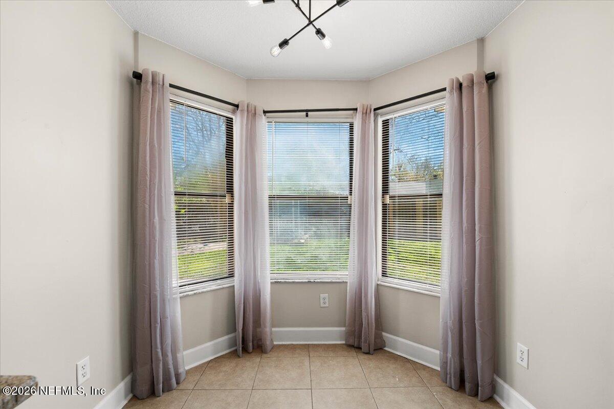 3255 Dowitcher Lane Orange Park, FL 32065 - Photo 9 of 39 a view of an empty room with a window