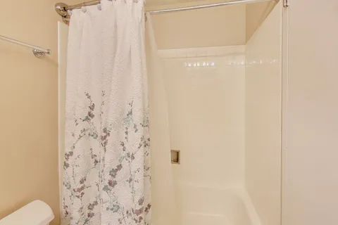 a bathroom with a shower curtain