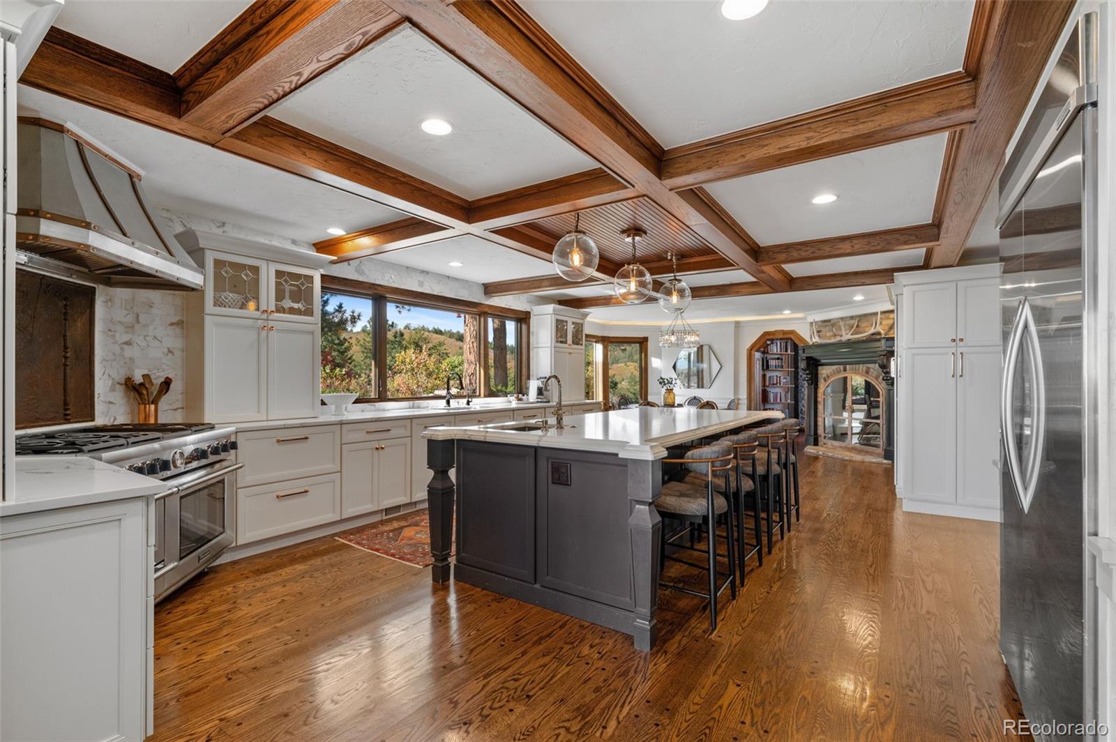 7225 West Box Canyon Road Sedalia, CO 80135 - Photo 14 of 49 a kitchen with stainless steel appliances granite countertop lots of counter top space