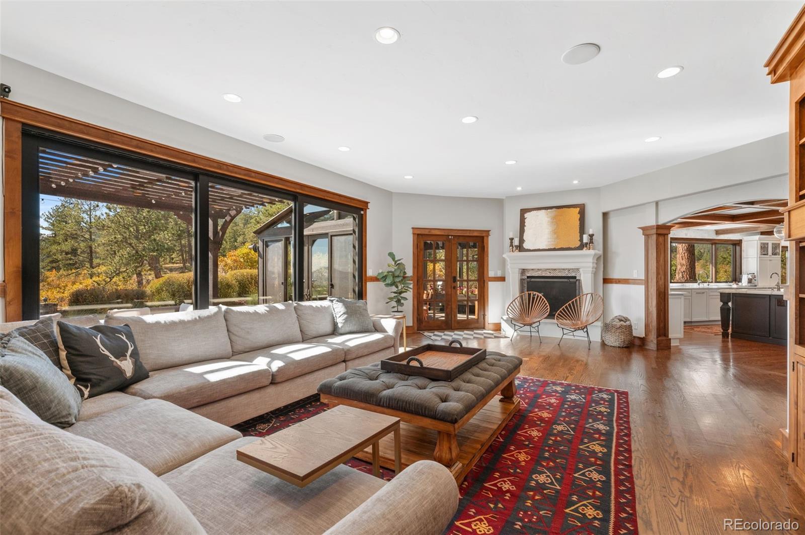 7225 West Box Canyon Road Sedalia, CO 80135 - Photo 20 of 49 a living room with furniture and a fireplace