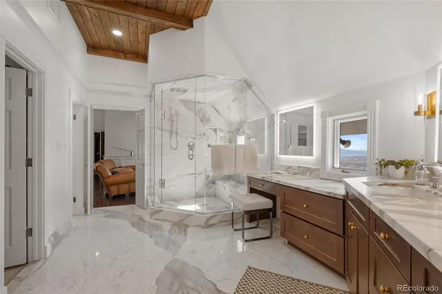 a large bathroom with a sink a large mirror and a bathtub